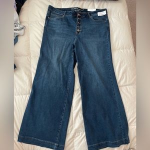 Denim bell bottom style jeans with buttons